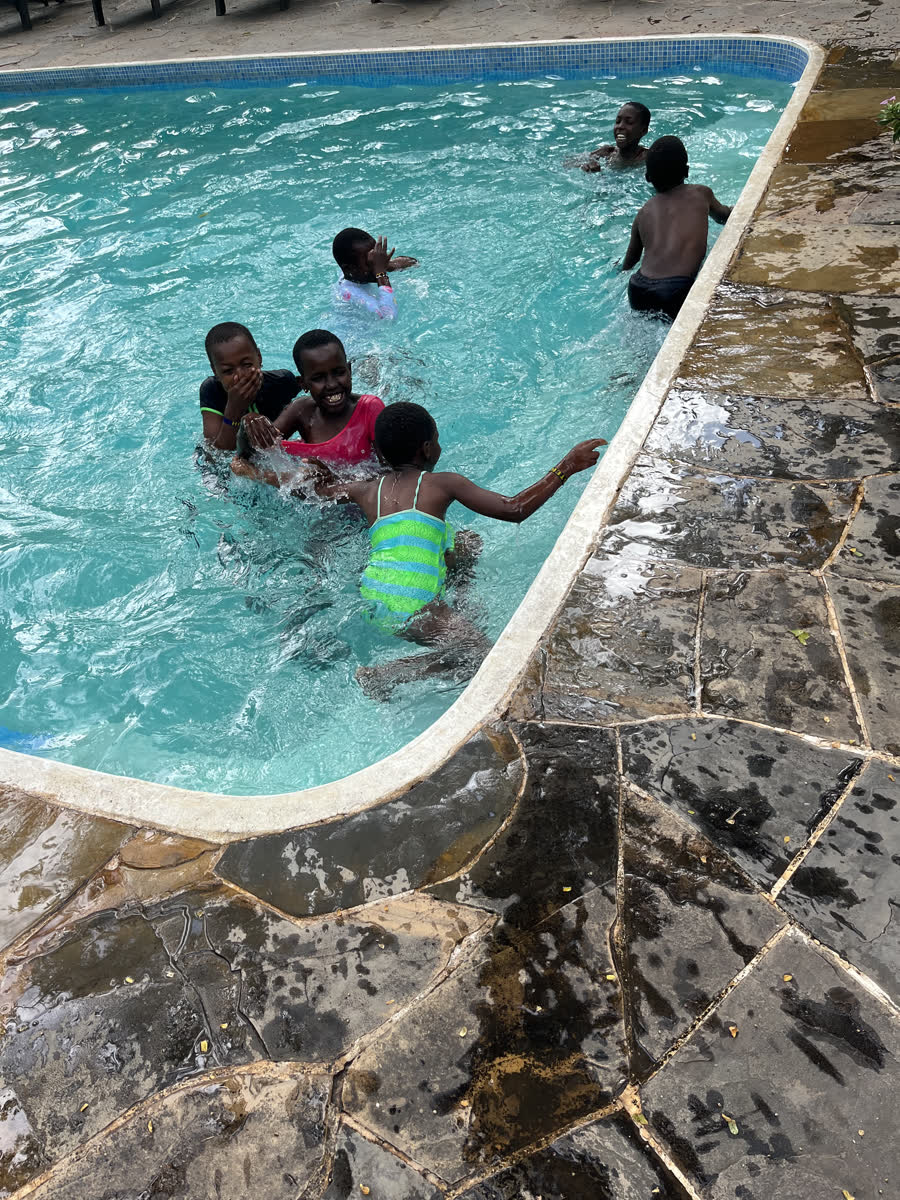 Children playing together in a swimming pool.
